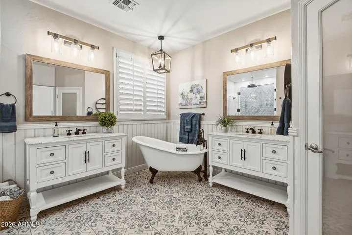 HIS and HER vanities. Separate claw-foot tub
