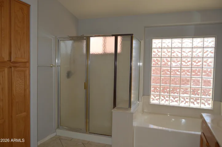 Primary Bathroom with Shower, Tub, 2 Vanities and Water Closet