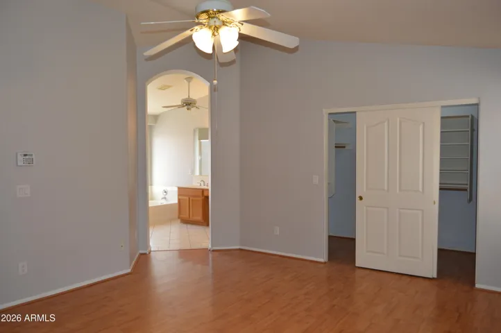 Primary Suite with Large Walk-in Closet and Entry from Backyard