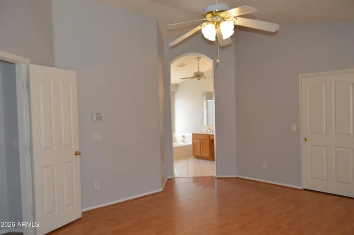 Primary Suite with Large Walk-in Closet and Entry from Backyard
