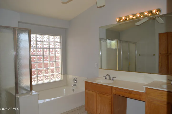 Primary Bathroom with Shower, Tub, 2 Vanities and Water Closet