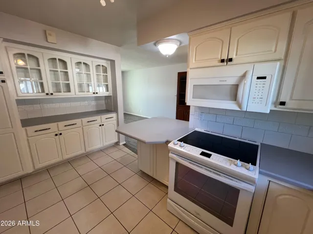 Kitchen appliances nicely arranged.