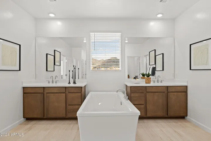 Photos of model home, options may vary. Primary Bath features soaking tub & shower!