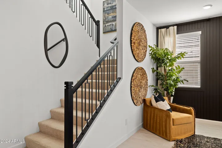Photos of model home, options may vary. The stair railing is like a piece of art!