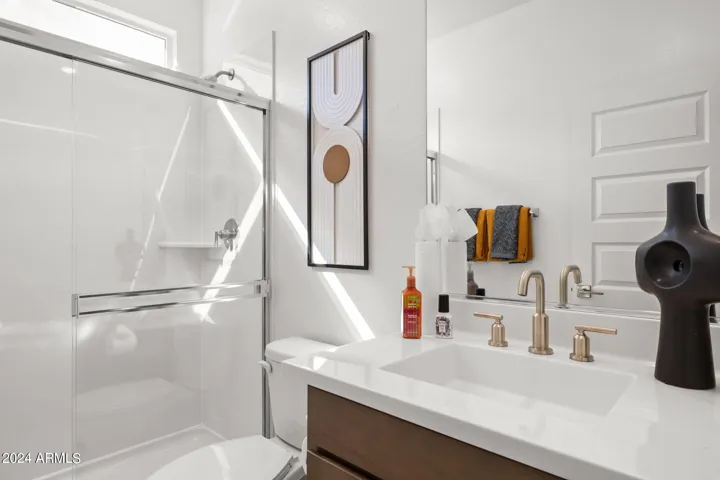 Photos of model home, options may vary. Main hall bath, located off the main living area and libary.
