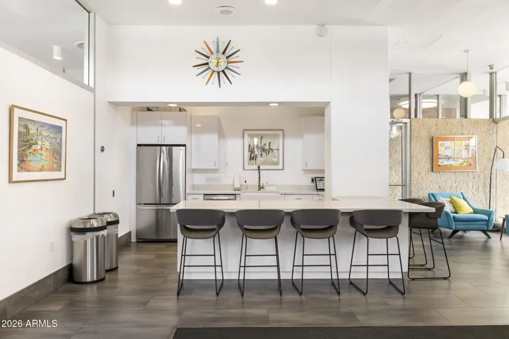 Shared kitchen and bar area within the resident social space.