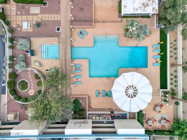 Aerial view of the heated pool, spa, and landscaped courtyard framed by iconic mid-century architecture.