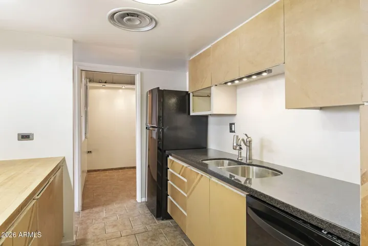 Versatile enclosed space ideal for a home office, studio, or additional storage.