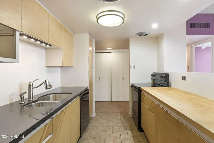 Original Beadle cabinetry with signature indented pulls and generous counter space.