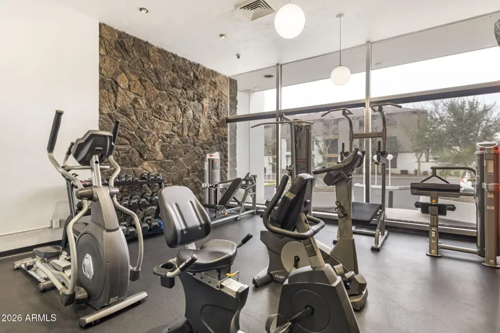 Community fitness room with cardio and strength equipment.