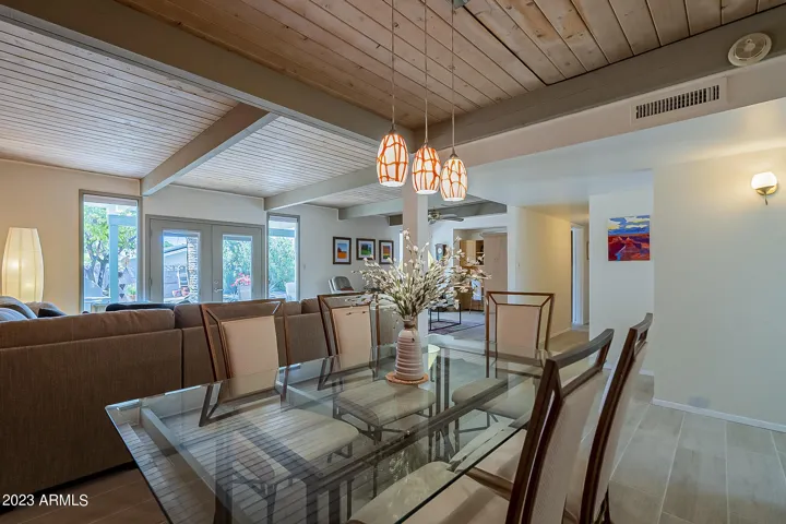 Dining area in great room with original wood ceilings
