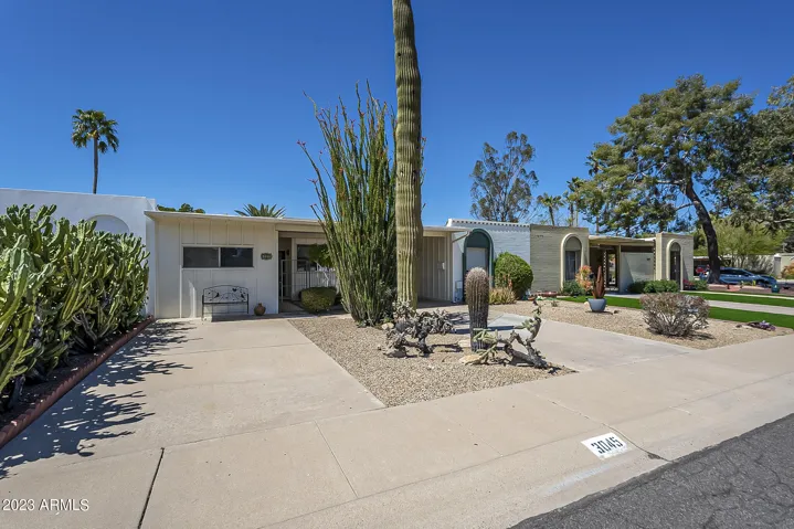 Exterior Front - ample parking on driveway and carport
