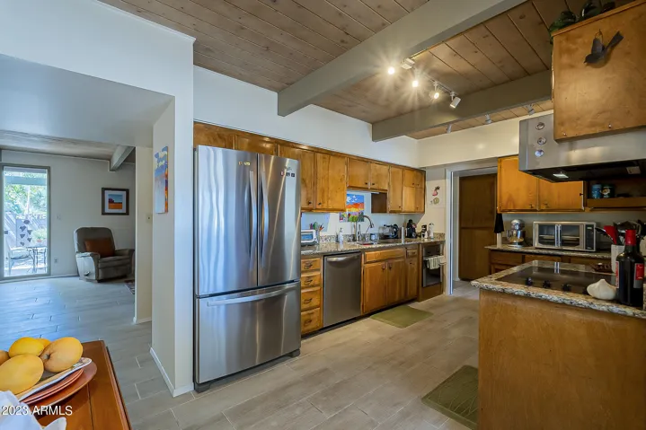 Spacious kitchen with ample cabinets, SS appliances and granite countertops