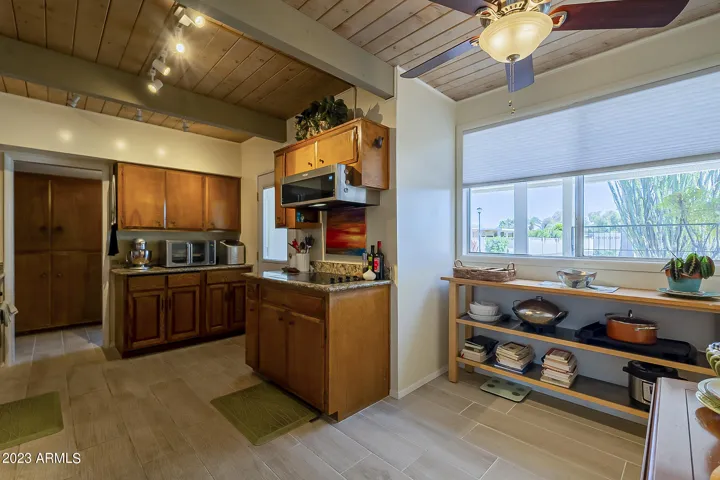 Spacious kitchen with ample cabinets, SS appliances and granite countertops. Room for a table by the window.