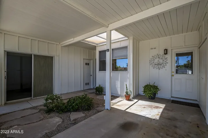 Private attached carport / entry (bonus room shown on left)