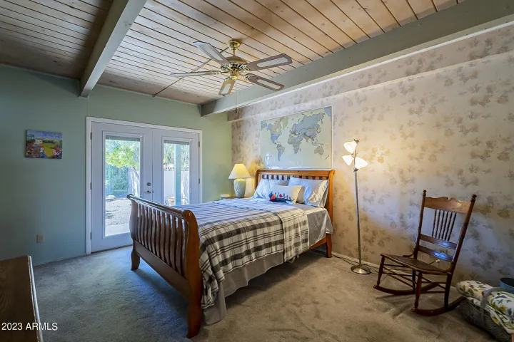 Primary Bedroom with doors to backyard