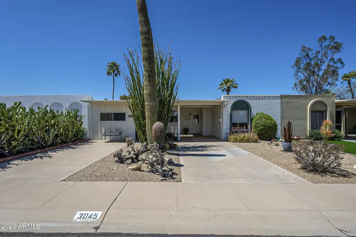 Exterior Front - ample parking on driveway and carport