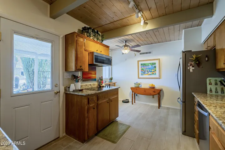 Spacious kitchen with ample cabinets, SS appliances and granite countertops