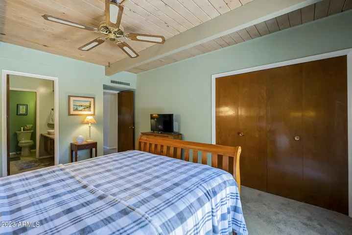 Primary Bedroom with doors to backyard