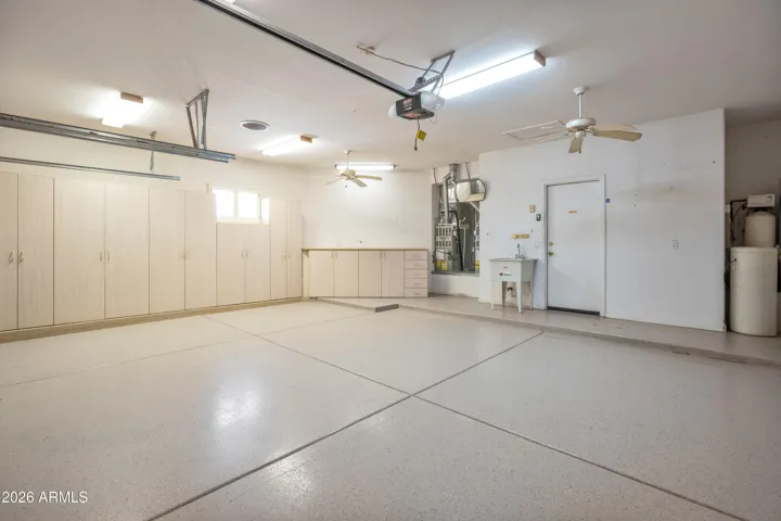 Garage with Extensive Built In Cabinetry