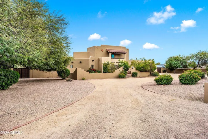 Front of home with partial circular driveway