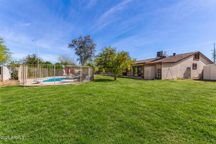 Digitally altered to show what yard could look like with natural grass