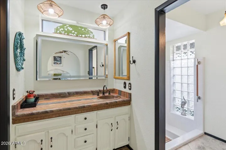 Primary vanity & shower/toilet room