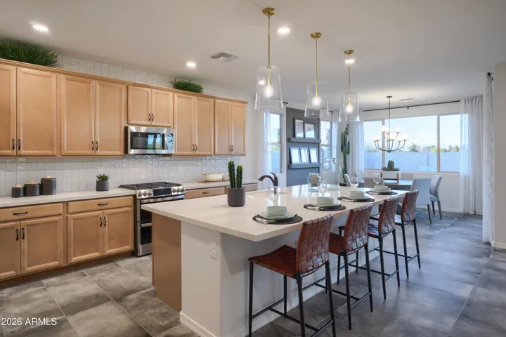 42" CABINETS, UPGRADED RANGE, QUARTZ COUNTERS, WALK IN PANTRY AND ALL APPLIANCES INCLUDED!