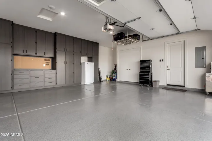 Custom floor to ceiling cabinets and built in workbench