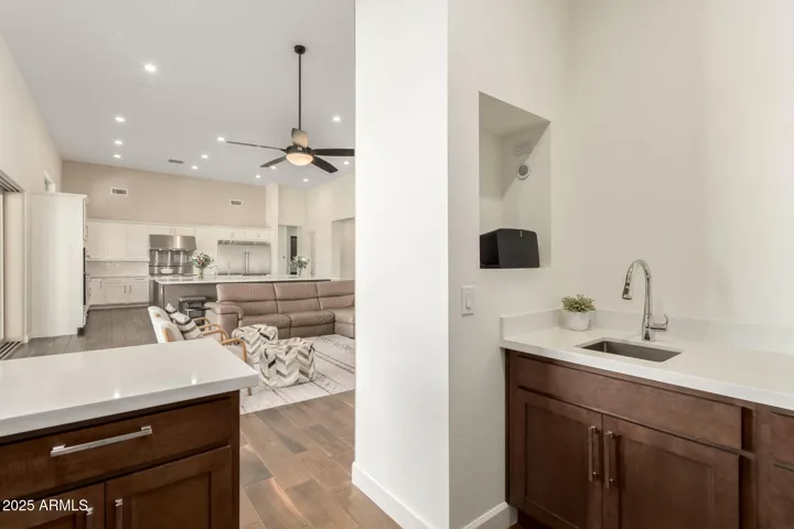 Indoor bar with sink and wine fridge
