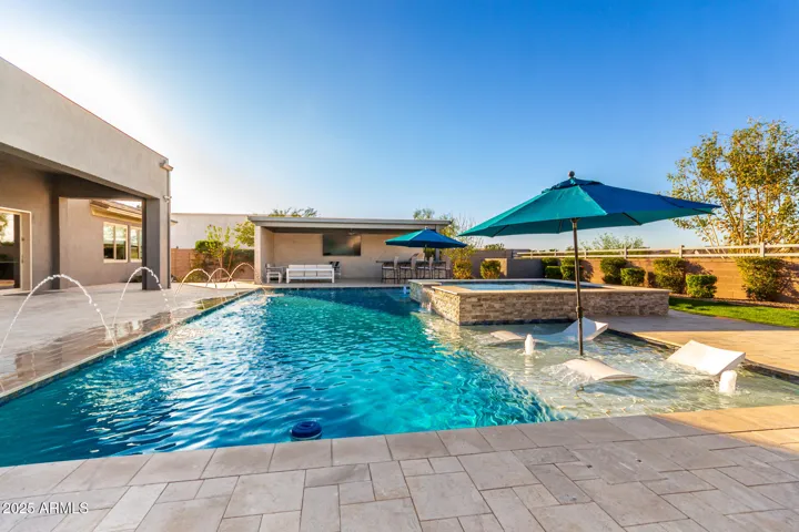 Lap pool with ledge loungers and Baja steps