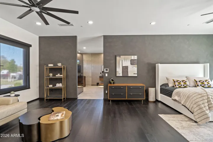 w/ spacious sitting area, 2 walk-in custom closets, and electric fireplace