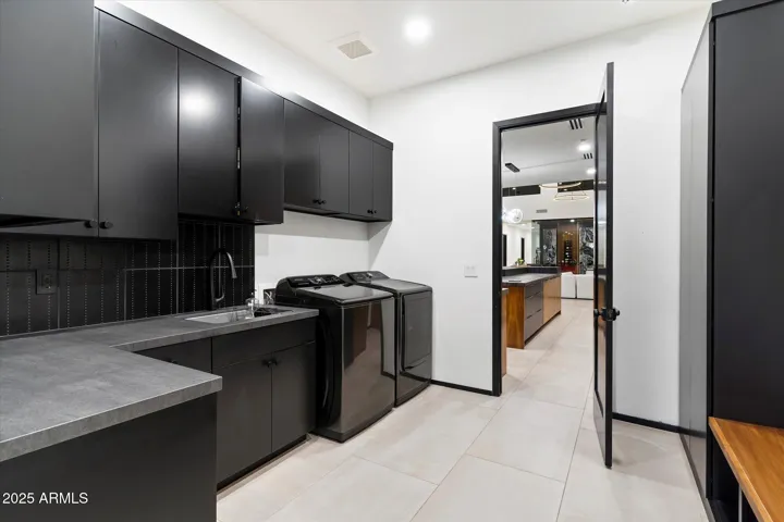 Custom cabinetry for lots of storage. Includes a half bath and accessibility to the backyard.