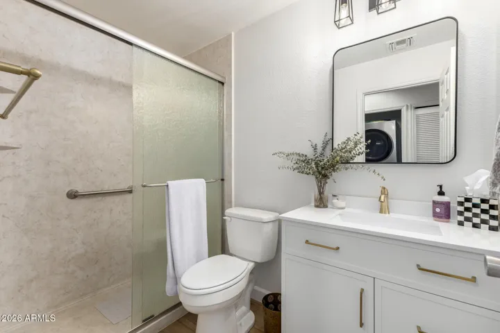 Secondary bathroom featuring vanity, shower/tub combination, and modern fixtures.