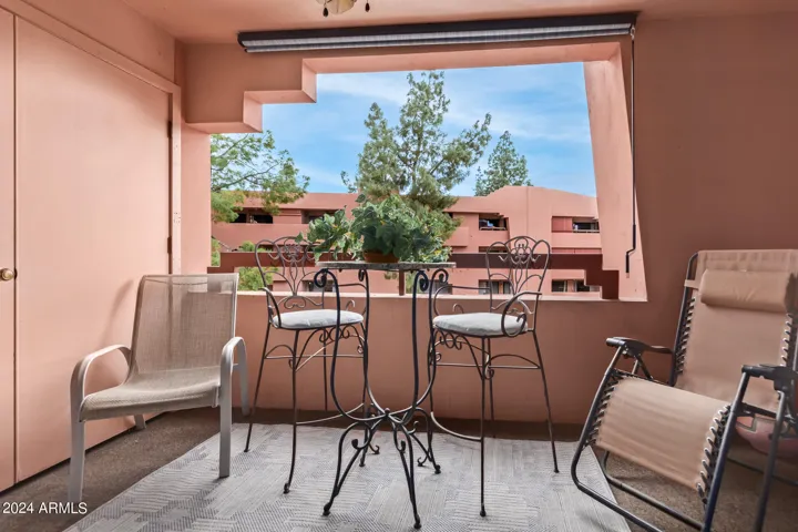 Private patio overlooking pool with laundry room