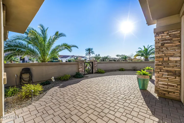 The inviting front courtyard offers a peaceful place to enjoy morning coffee or evening sunsets, with space for a comfortable patio set and views of the surrounding mountains. Where Arizona sunsets steal the show.