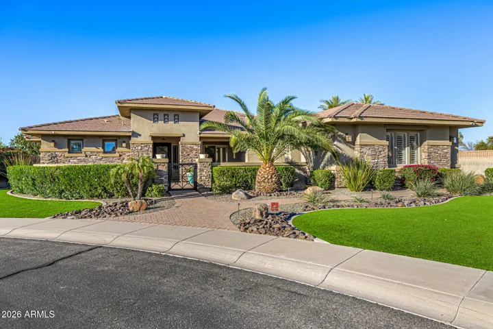 Spacious private lot at the end of the cul-de-sac allow for a wrap around 4-car garage entrance with access to an RV gate.