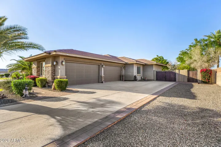 Spacious private lot at the end of the cul-de-sac allow for a wrap around 4-car garage entrance with access to an RV gate.