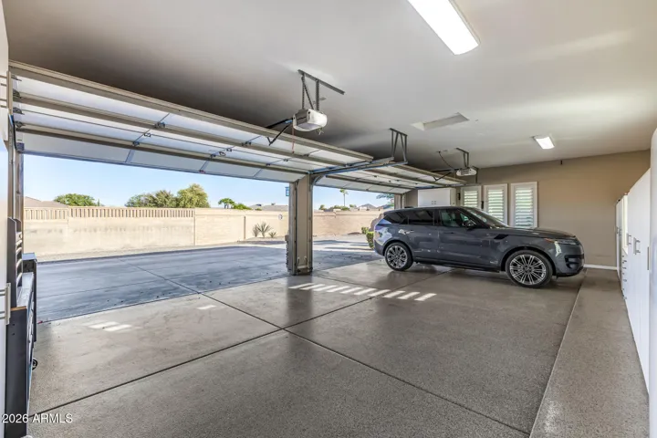 Wrap-around driveway, RV gate access, and 4 car garage