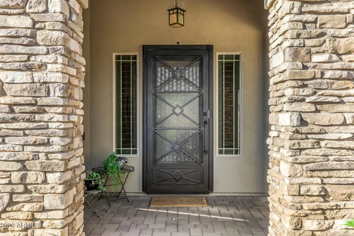 The added First Impressions security screen door and gate allow homeowners to enjoy cool desert breezes and peaceful mountain views while maintaining privacy and security.