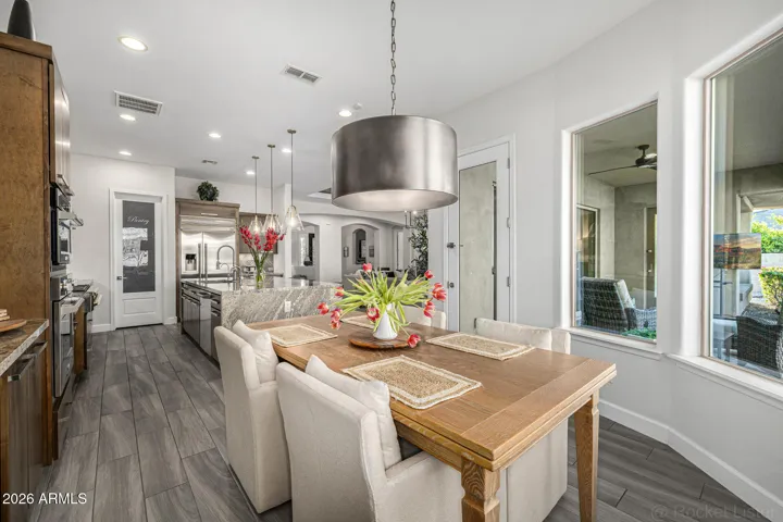 Upgraded lighting fixtures bring a sense of warmth and quiet luxury to the home’s interiors.