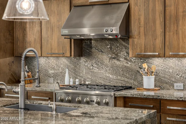 Custom upgraded cabinetry with soft-close design reflects thoughtful craftsmanship well beyond standard builder finishes.