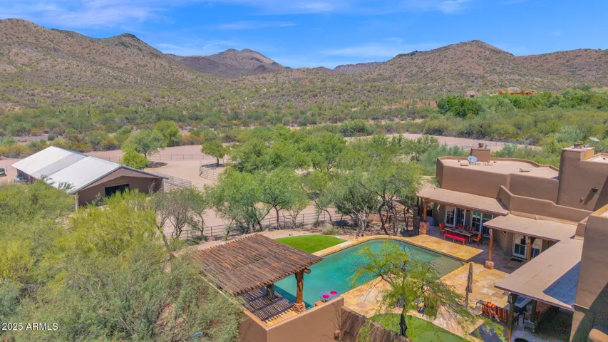 A True In-Town Equestrian Estate Offering Direct Trail & Preserve Access, Refined Desert Living, and Professional Grade Horse Facilities All On Nearly 10 Private Acres, Just Minutes From The Heart of the Cave Creek Art and Entertaining District.