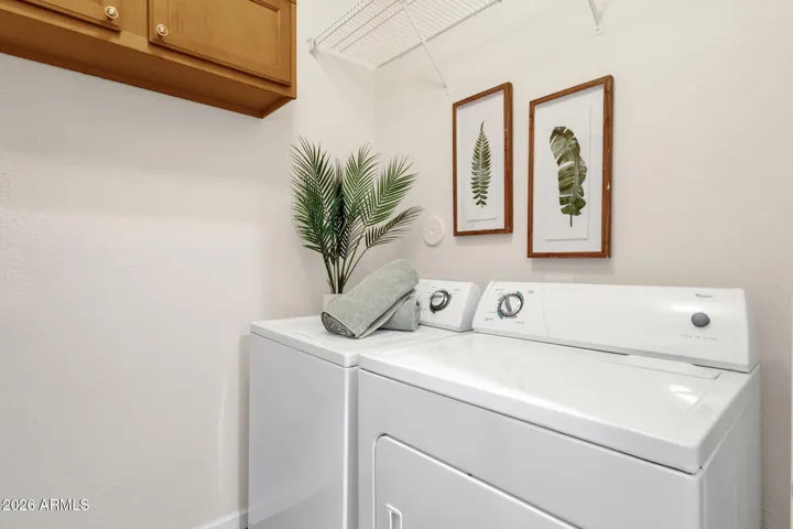 Washer/dryer included as well as cabinets and shelf storage