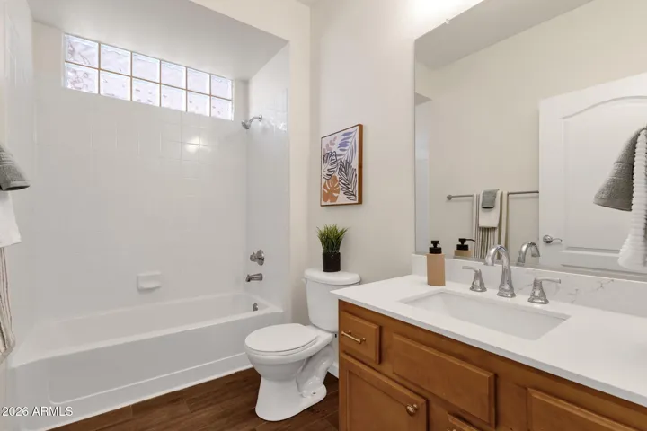 New quartz countertop, sink, faucet, and lighting. Adjacent to bedroom 2