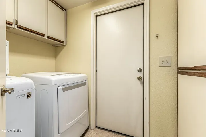 laundry room with extra storage cabinetes