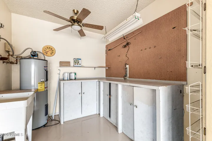 workshop area and utility sink in garage