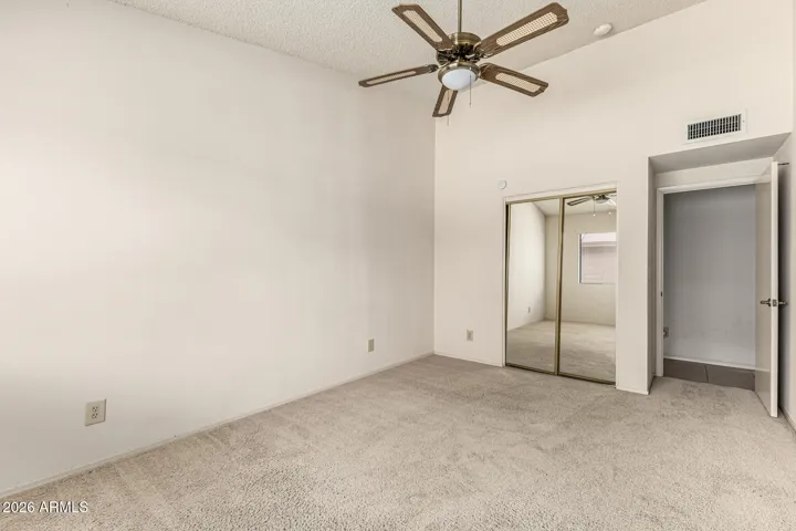 bedroom 2 with mirrored closet doors
