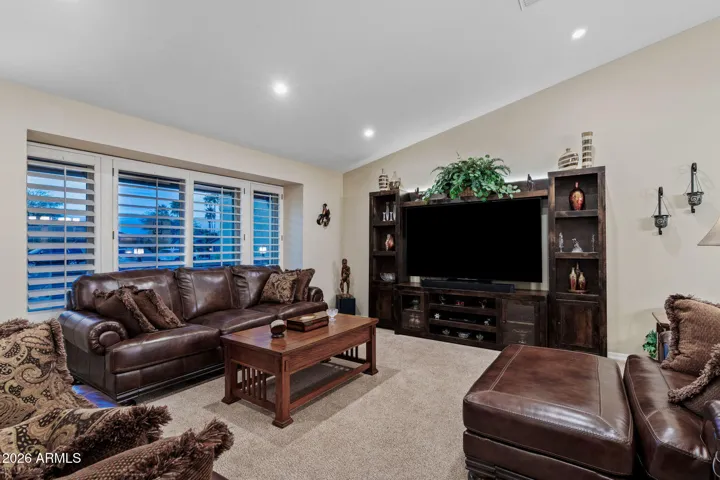 The great room with recessed lighting is large and open.