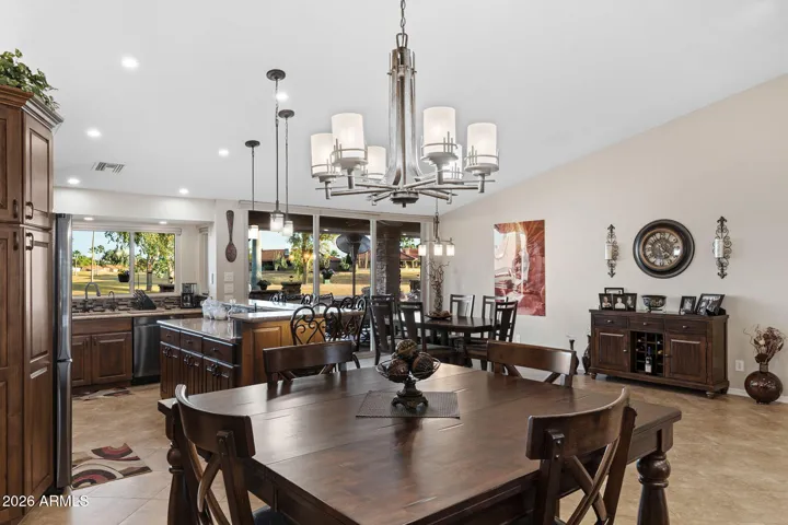 The formal dining offers elegance with views to the amazing kitchen and golf course.